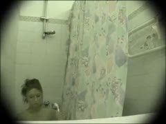 Auburn in the attire of a dilettante chick having a shower in a hidden webcam video